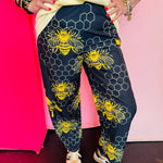 Black and yellow bee print wide leg pants with elastic waist and pockets.