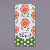 Floral tea towel with orange and yellow flowers, green accents, polka dots, and blessed script