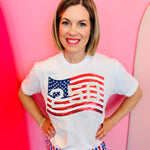 White tee with red white and blue sequin American flag patch