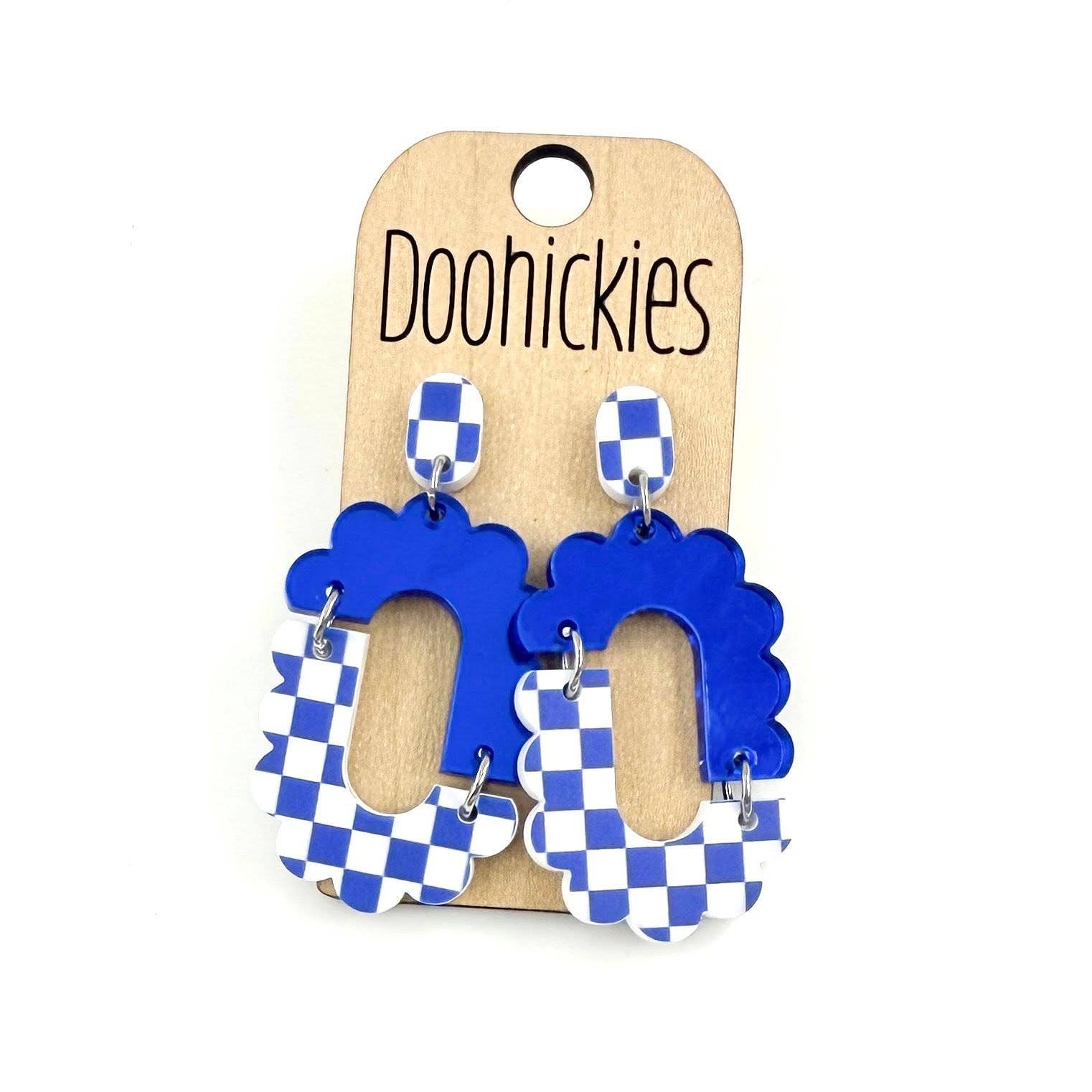 Blue checkered acrylic dangle earrings with hypoallergenic stainless steel settings.