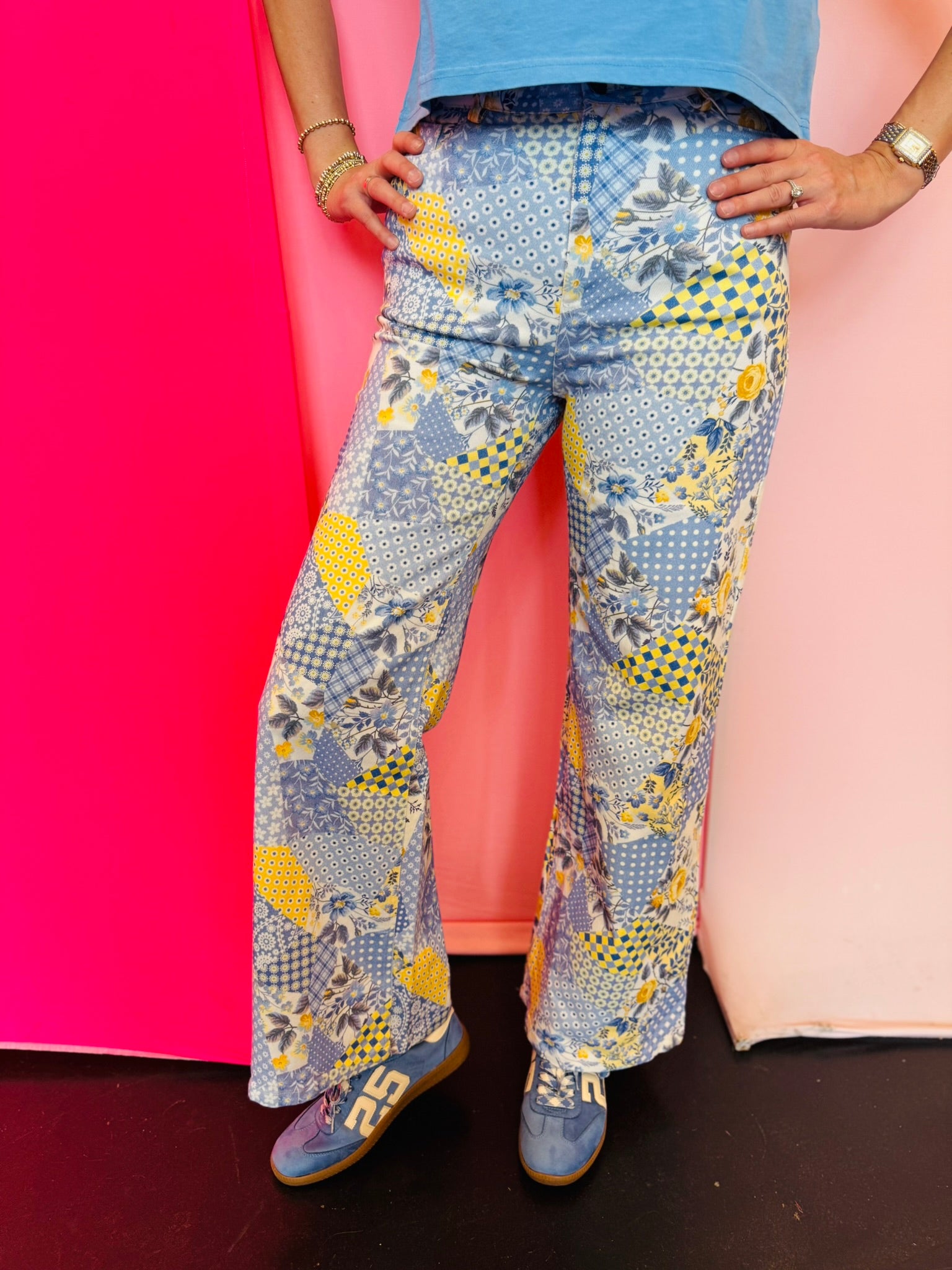 Floral patchwork wide leg denim pants with colorful mixed print design.