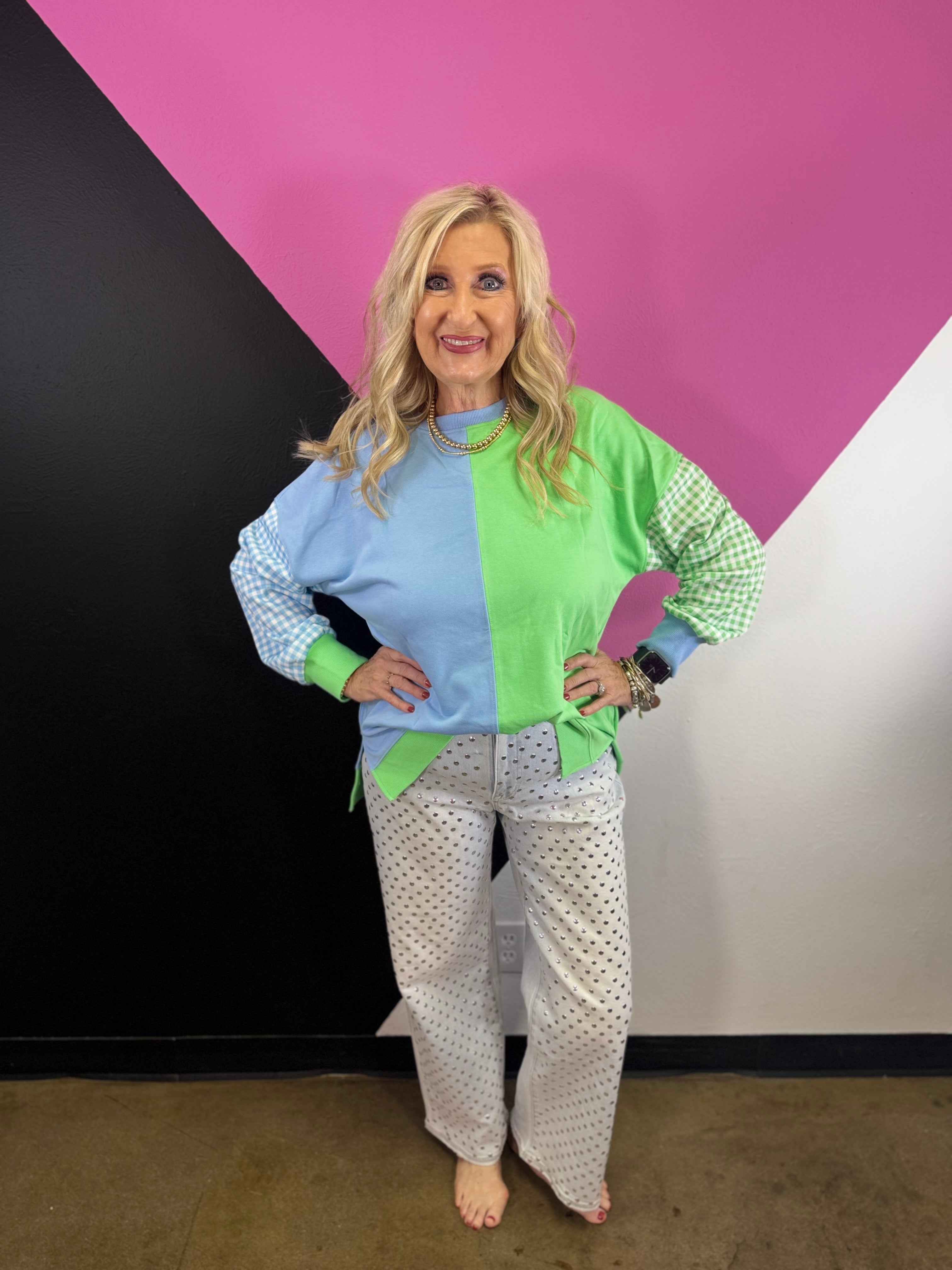 Blue and green colorblock sweatshirt with gingham sleeves and high-low hem.