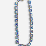 Blue crystal necklace with faceted rectangular stones and shimmering iridescent finish.