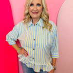 Blue and yellow striped peplum top with button front, collar, and three-quarter sleeves