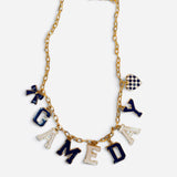 Blue and white game day necklace with gold-tone chain, letter, bow, heart, and megaphone charms.