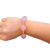 Blush pink bubble bracelet with oversized glossy beads and gold accents.