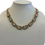 Antique gold tone necklace with round pink stones and bold rounded links