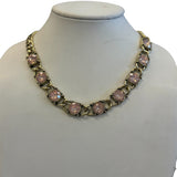 Antique gold tone necklace with round pink stones and bold rounded links