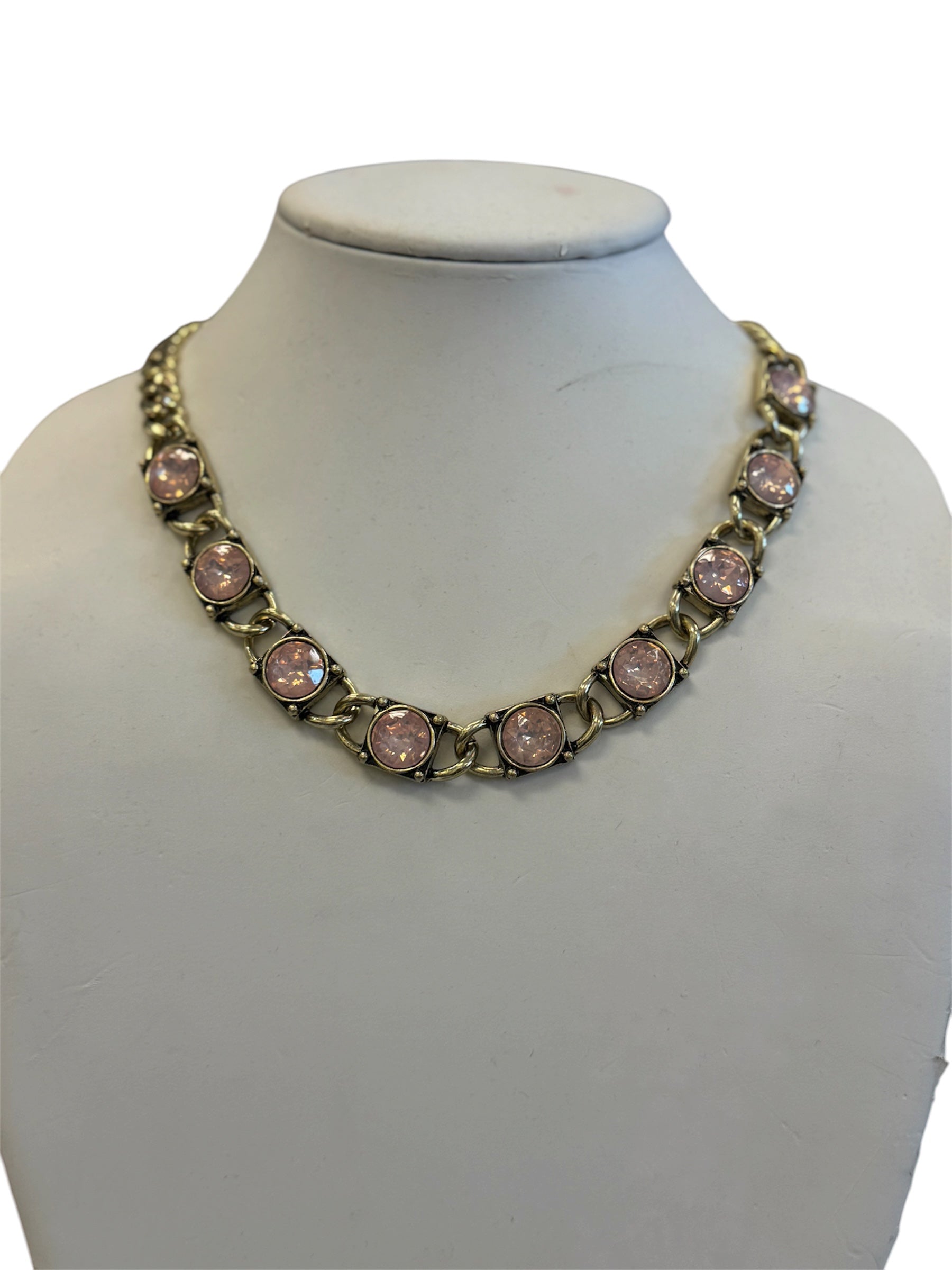 Antique gold tone necklace with round pink stones and bold rounded links