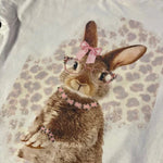 Leopard background bunny tee with pink rhinestone glasses and jewelry.