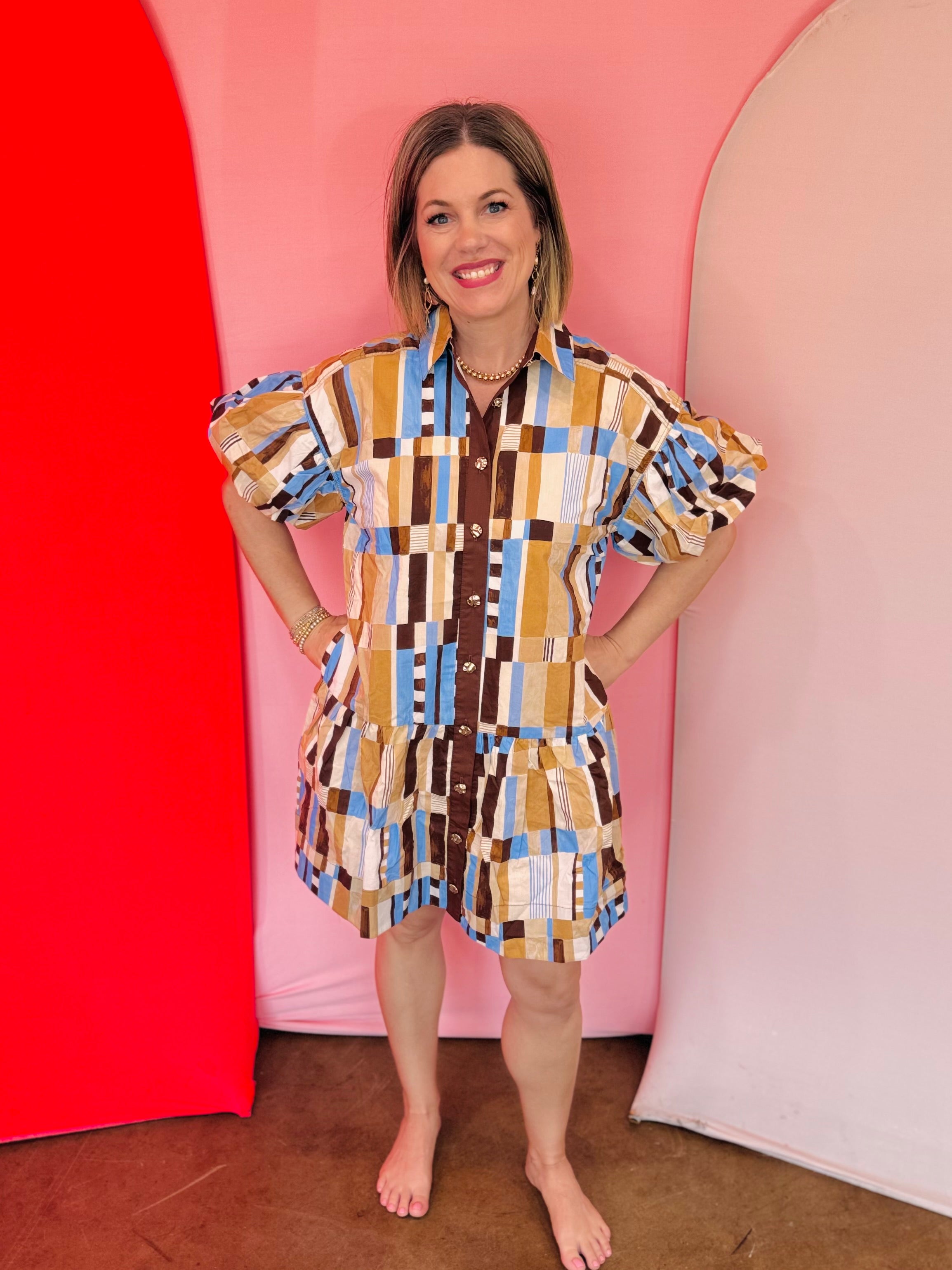 Brown and blue geometric print cotton mini dress with puff sleeves, collar, and tiered hem.