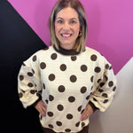 Brown and ivory reversible sweatshirt with polka dot and stripe patterns and mock neckline.