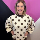 Brown and ivory reversible sweatshirt with polka dot and stripe patterns and mock neckline.