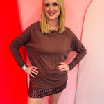 Brown cotton raglan top with thumbhole cuffs.