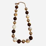 Caramel and ivory beaded necklace with marbled details and gold accent beads