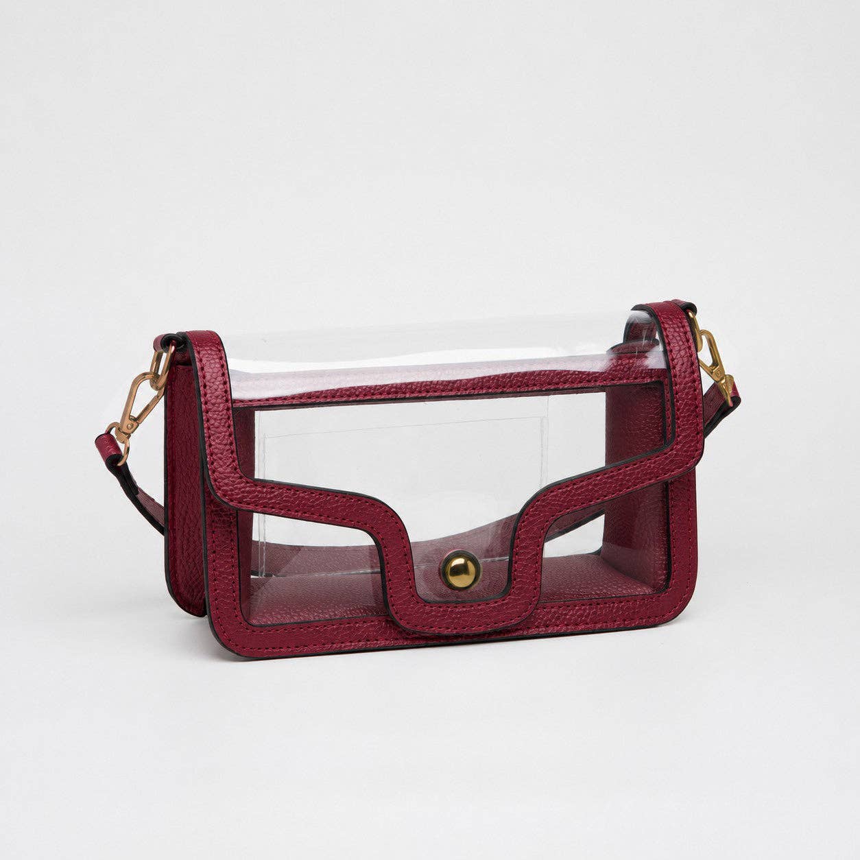 Clear burgundy game day shoulder bag with gold hardware, removable strap, and magnetic closure.