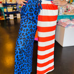 Patriotic cropped pants with blue leopard print and red white stripe design.