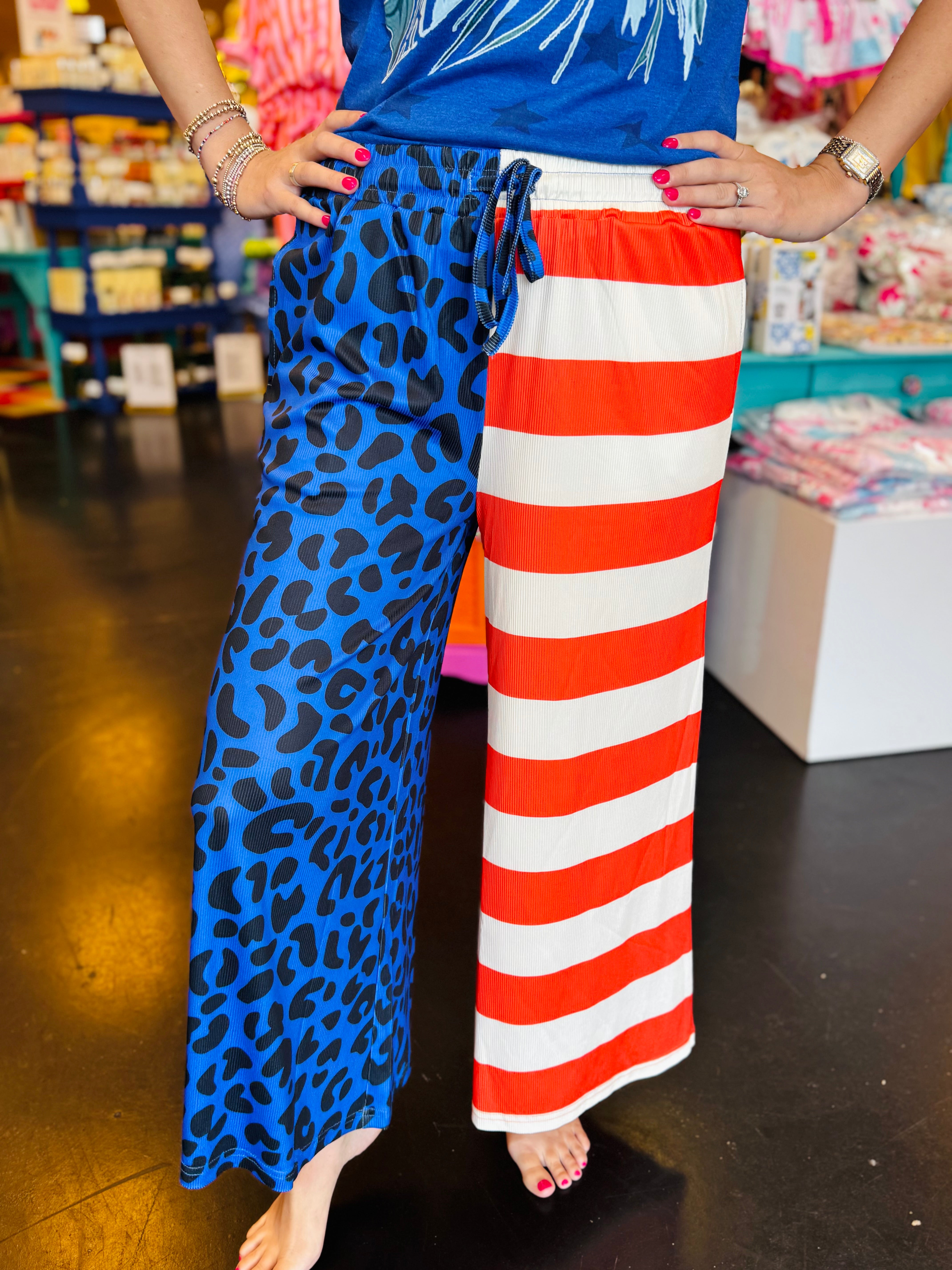 Patriotic cropped pants with blue leopard print and red white stripe design.