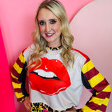 Black cropped mesh top with red lipstick graphic and fitted sheer design.