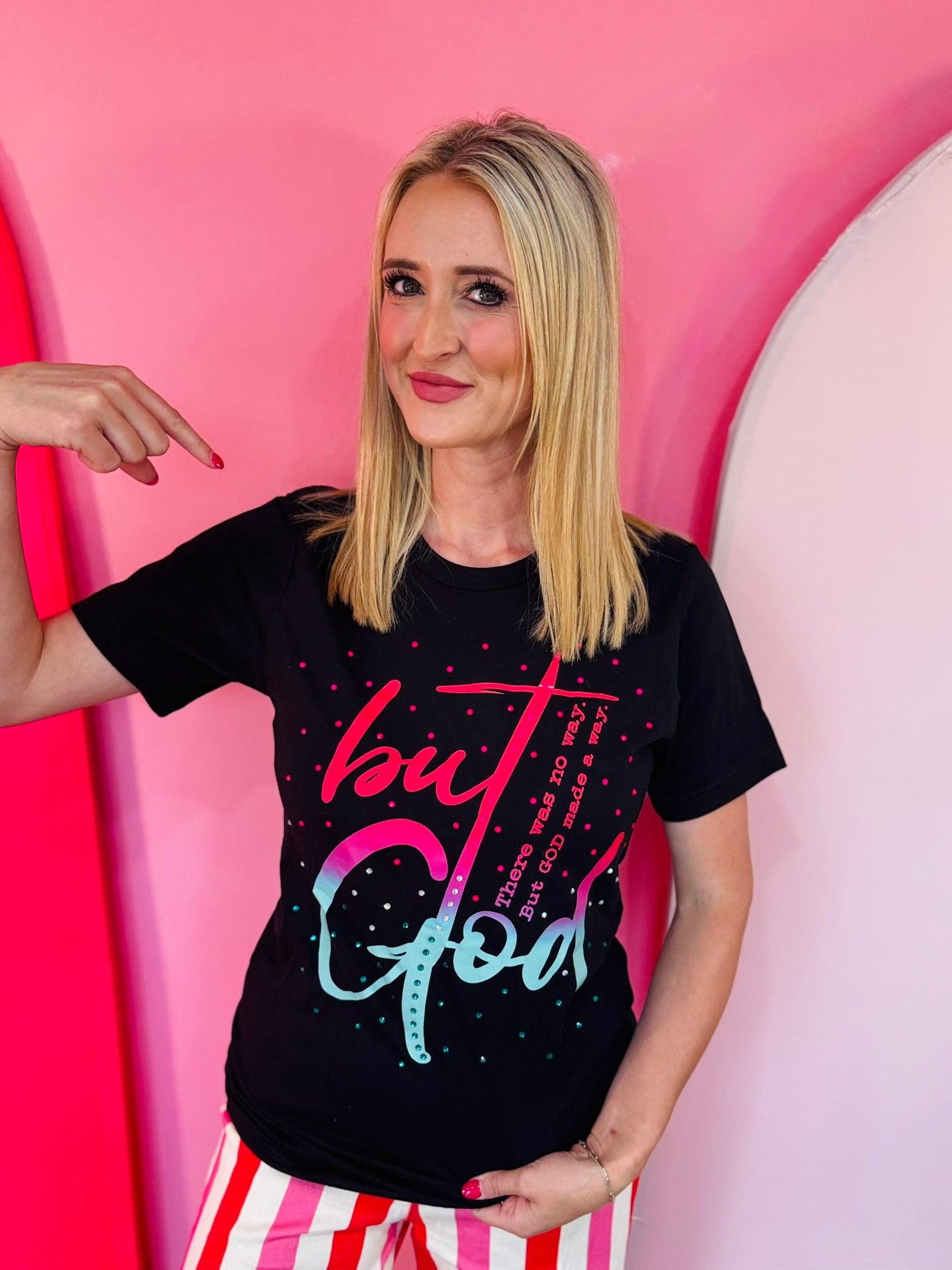Black faith tee with neon But God graphic and colorful rhinestones.