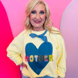 Butter yellow oversized Mother sweatshirt with denim heart patch lettering.
