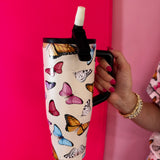 40oz butterfly print tumbler with flip straw lid and handle.