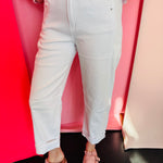 White high-waisted cropped barrel pants with cuffed hem and relaxed leg silhouette for everyday style.