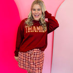 Burgundy fall pullover with plaid “Thanks” patch and relaxed fit