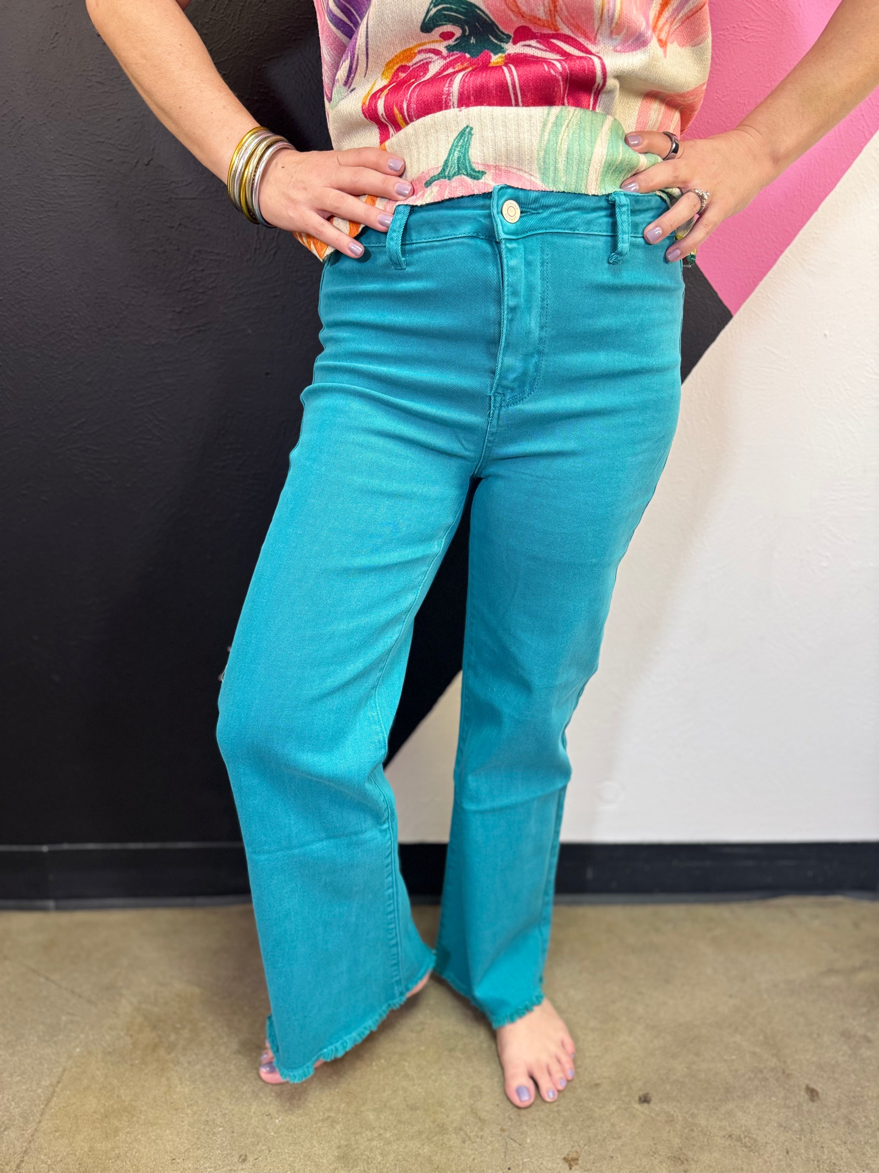 Zenana teal acid wash wide leg jeans with frayed cutoff hem.