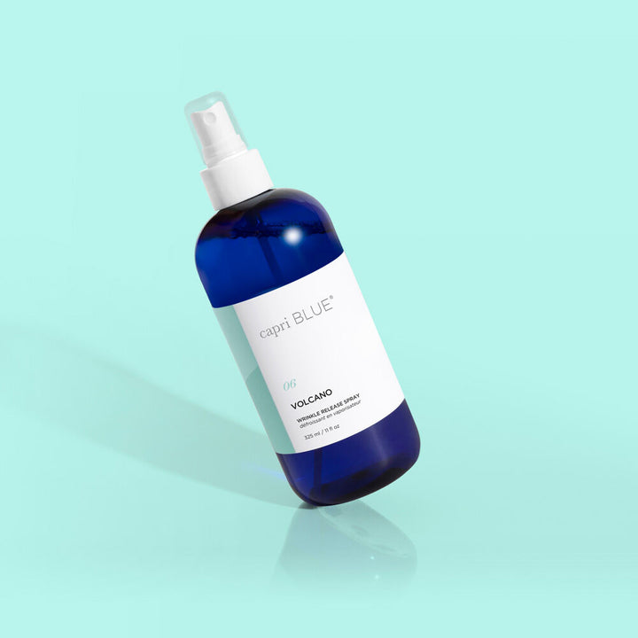 Capri Blue Volcano Wrinkle Release Spray bottle for refreshing fabrics with tropical citrus fragrance