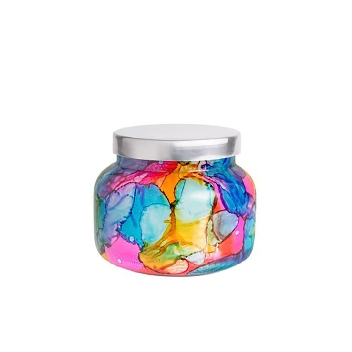 Rainbow watercolor glass jar candle with vibrant colors and a tropical fruit and citrus Volcano scent; decorative 19oz candle for home fragrance and style.