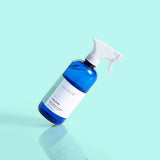 Volcano Multi-Surface Cleaner bottle with refreshing citrus scent and grapefruit essential oil, designed to clean and freshen a variety of surfaces.
