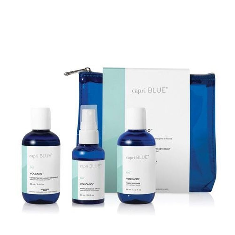 Volcano Laundry Gift Set – travel-size detergent, fabric softener, and wrinkle release spray in tropical citrus fragrance.