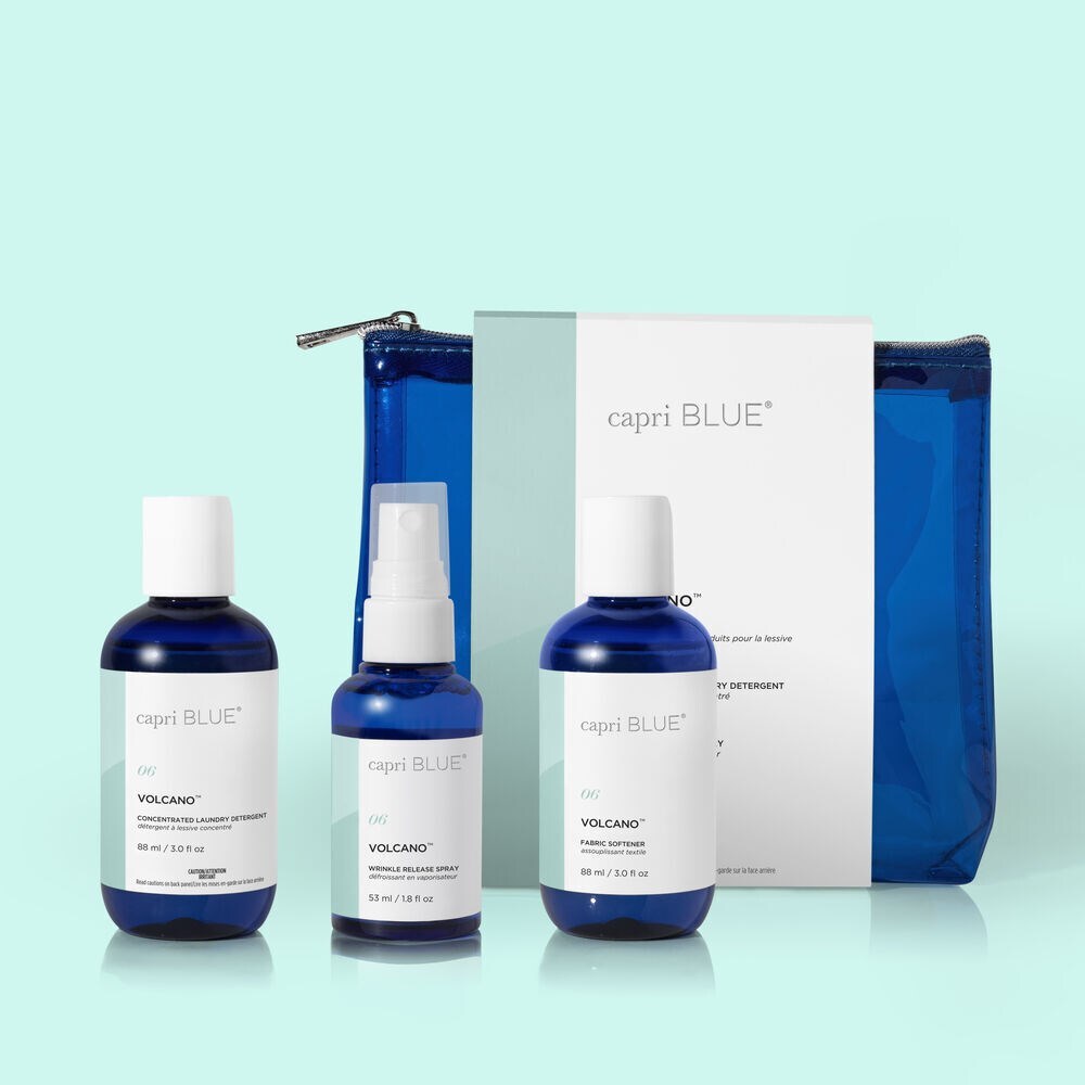 Volcano Laundry Gift Set – travel-size detergent, fabric softener, and wrinkle release spray in tropical citrus fragrance.