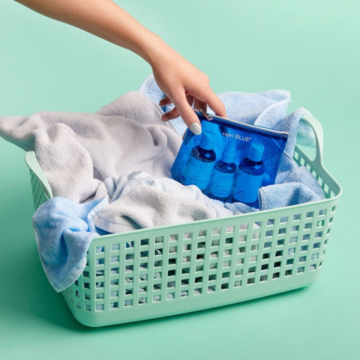 Volcano Laundry Gift Set – travel-size detergent, fabric softener, and wrinkle release spray in tropical citrus fragrance.