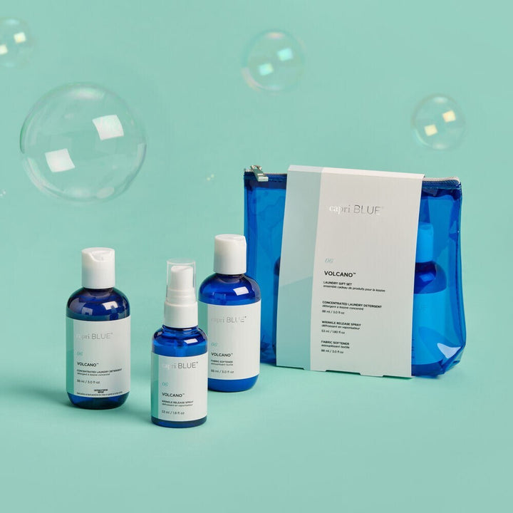 Volcano Laundry Gift Set – travel-size detergent, fabric softener, and wrinkle release spray in tropical citrus fragrance.