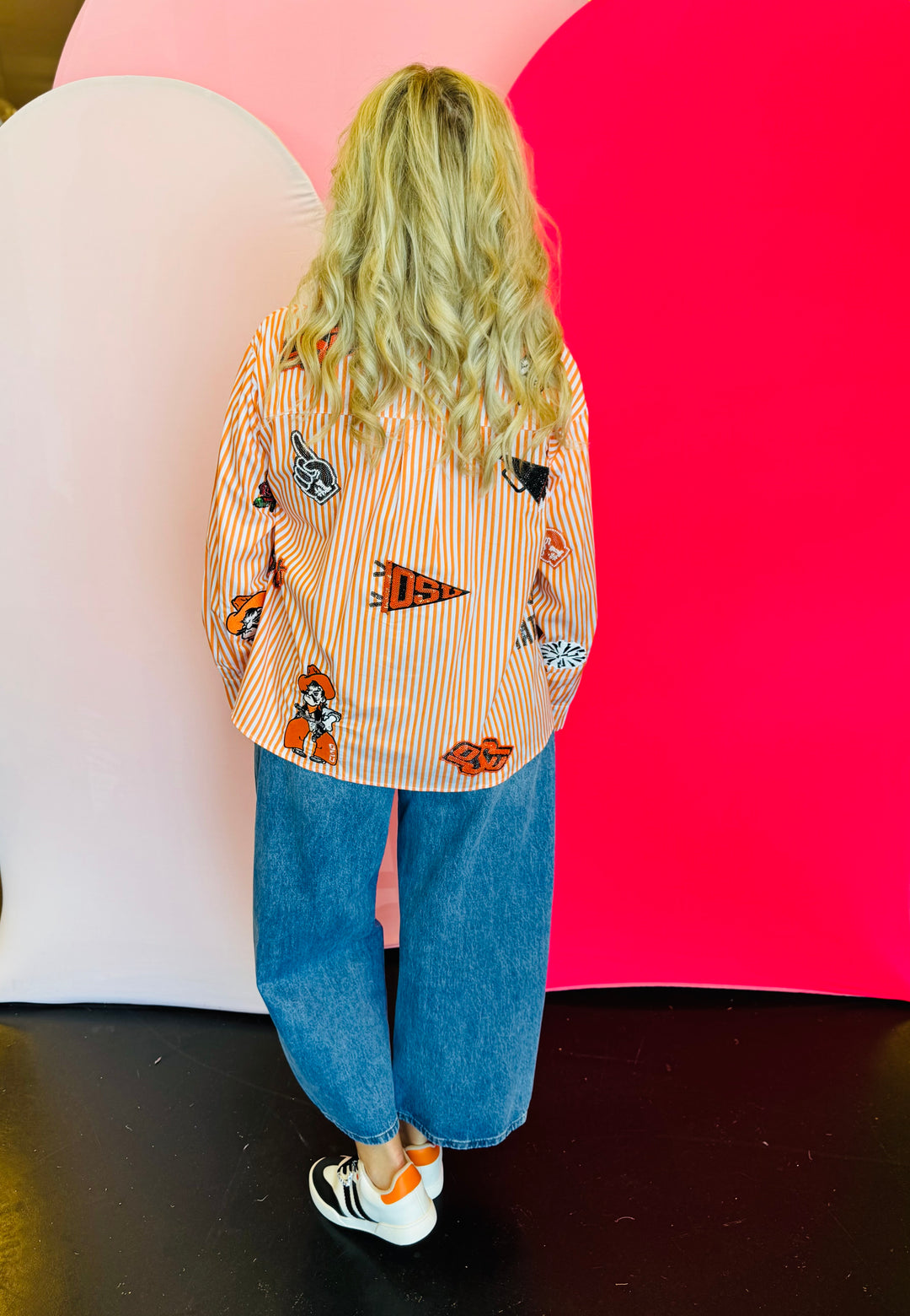 Back side of Queen Of Sparkles orange and white striped icon Oklahoma State University game day blouse.