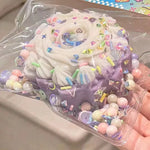 Cake-shaped pinch squishy stress toy with soft sensory texture.