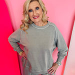 Sleet-colored cotton French terry pullover with contrast stitching, crew neckline, long sleeves, relaxed fit.