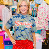 Camo patriotic top with red and white America graphic.