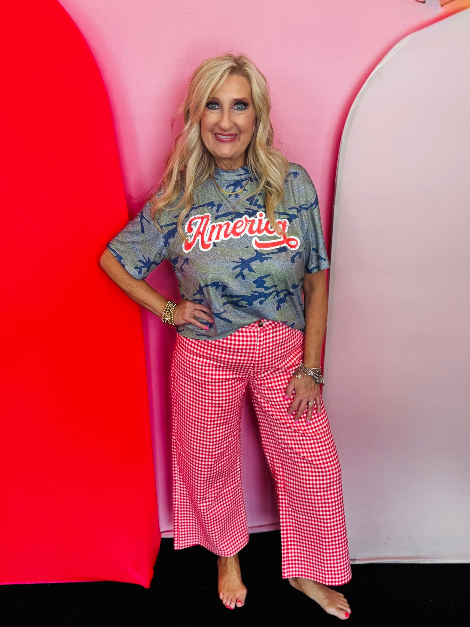 Camo patriotic top with red and white America graphic.