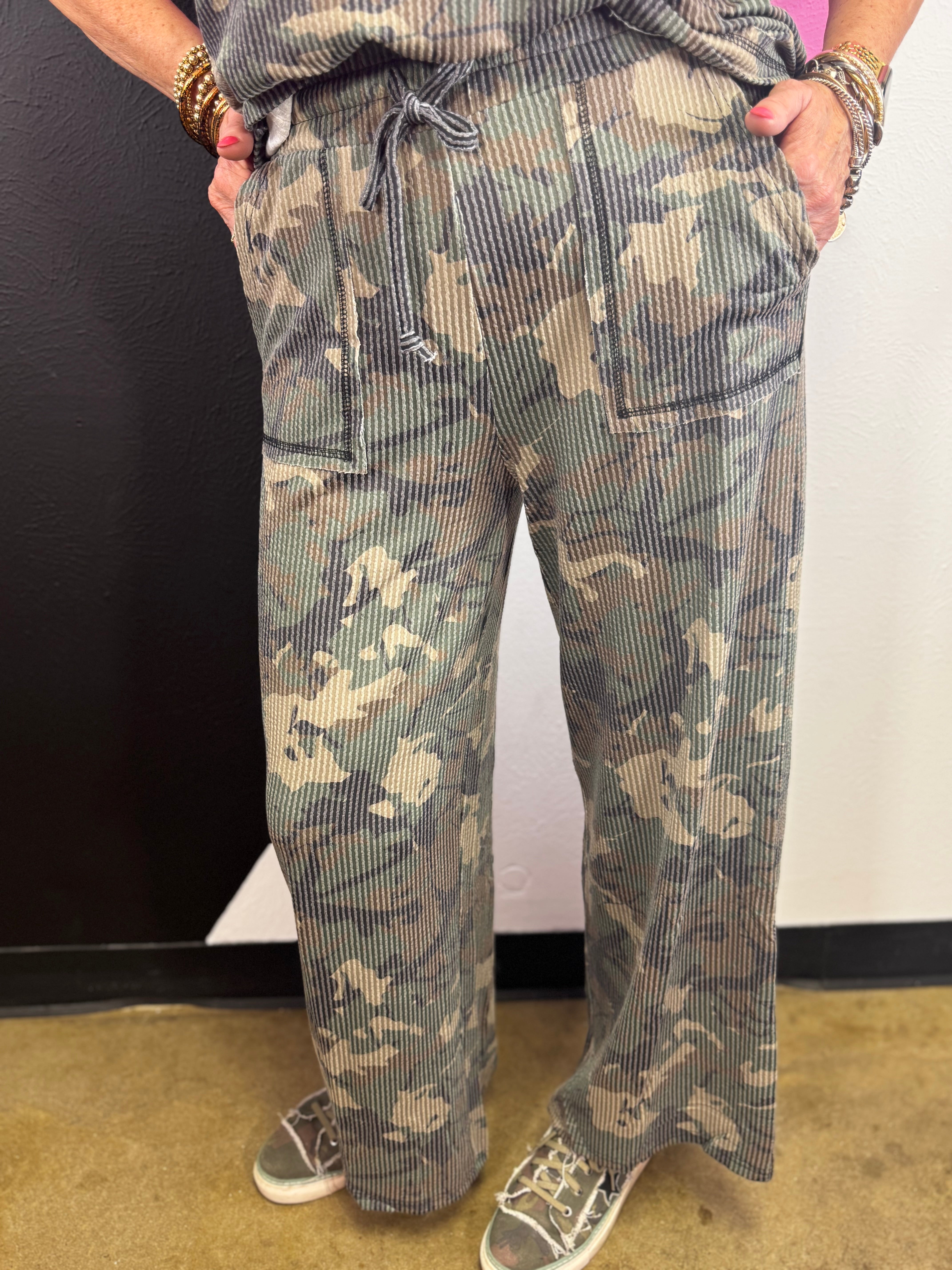 Camo pull-on pants with olive, forest green, and brown camouflage print.