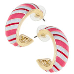 Gold-tone hoop earrings with red, pink, and white diagonal enamel stripes resembling candy canes.