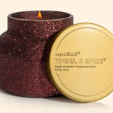 Capri Blue Tinsel & Spice Glam Candle in maroon glitter jar with warm festive holiday fragrance.