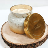 Capri Blue Volcano Glimmer Candle, 28oz, in a winter white  gold jar.