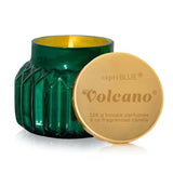An 8oz Capri Blue Volcano Royal Gem Petite Candle in a decorative green jar.