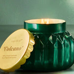 Capri Blue - 19oz Volcano Royal Gem Signature Candle in a faceted emerald green jar with a gold lid.