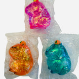 Capybara jelly squishy with glitter, soft sensory fidget toy for stress relief and play.
