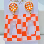  Orange and white checkered acrylic dangle earrings with orange polka dot stud.