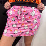 Pink checkered Halloween skort with ghosts, bats, candy corn and built-in shorts.